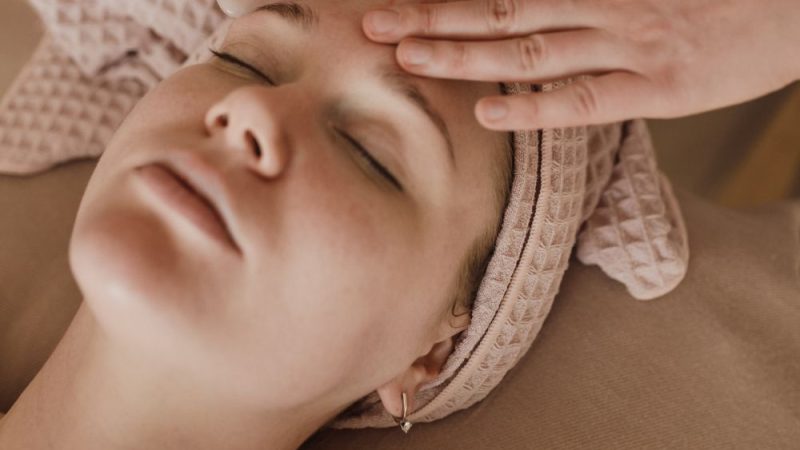 Woman having a beauty treatment on her forehead
